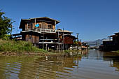 Inle Lake Myanmar. All the buildings are constructed on piles. Residents travel around by canoe, but there are also bamboo walkways and bridges over the canals, monasteries and stupas. 